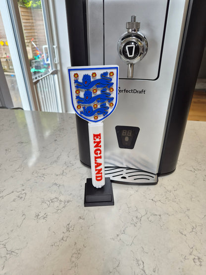 Close-up detail of England football themed beer tap handle showing premium finish and patriotic design